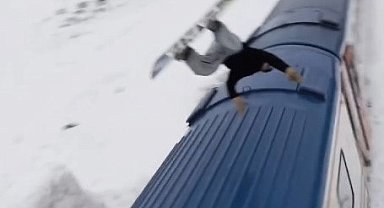 Snowboardla Doğu Ekspresi'nin üzerinden atladı